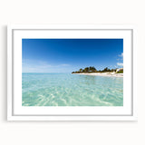 Abstract textured art print depicting a Caribbean seascape in cool blue and white tones on a framed mat.