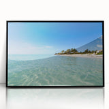 Large abstract wall art featuring a Caribbean scene in muted blue and green tones on a framed acrylic.