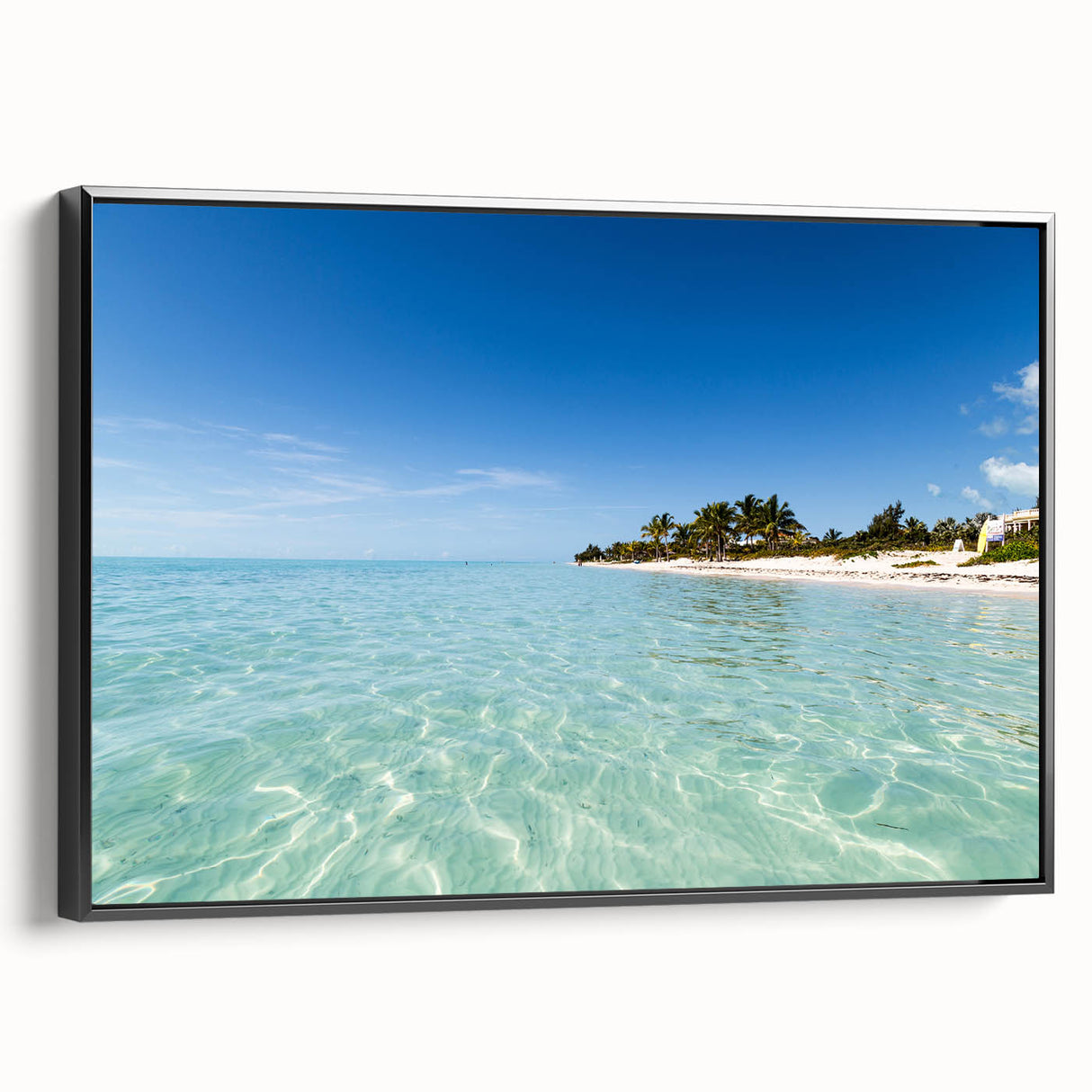 Framed canvas featuring a black and white vintage poster of a Caribbean landscape, ideal for bedroom wall decor.