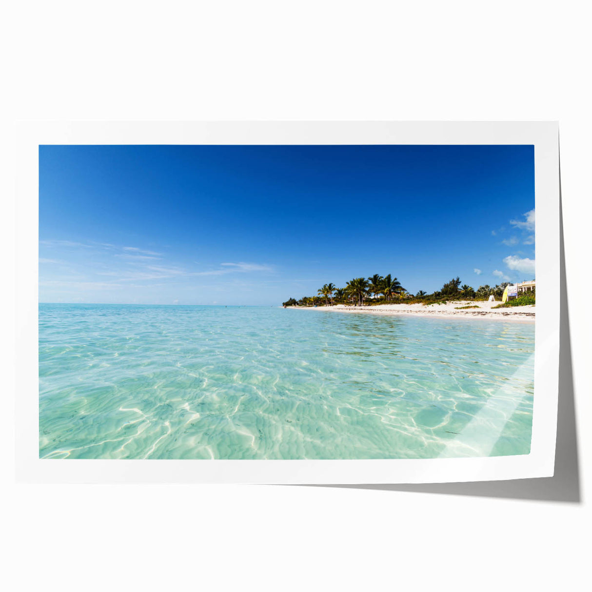 Extra large rolled print of a Caribbean scenery with vibrant turquoise waters and lush greenery.