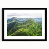 Abstract art print featuring textured, colorful swirls in a large black frame, ideal for living room decor.