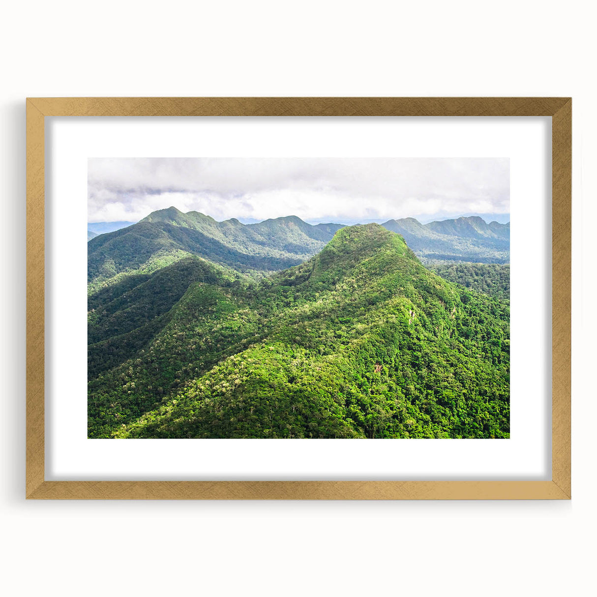 Abstract art print depicting a serene Belizean landscape in soft blue and green tones, framed in gold.