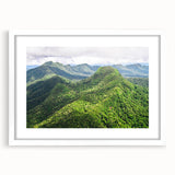 Textured abstract art print depicting Central American scenery in vibrant colors, framed with a white mat.