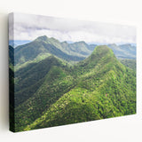 Side view of a stretched canvas depicting a Belize landscape in muted green and blue tones, suitable for kitchen wall art.