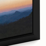 Framed canvas featuring a textured depiction of a Central American landscape, predominantly black with vibrant color accents.