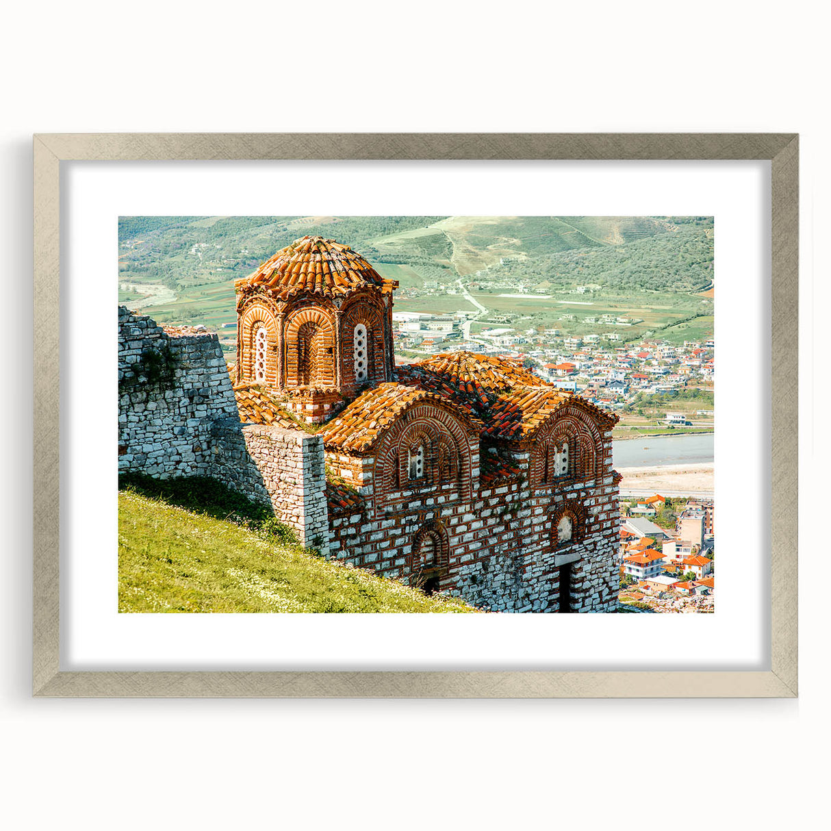 Textured abstract art print of a European landscape in muted earth tones, framed in silver, ideal for bedroom decor.