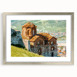 Textured abstract art print of a European landscape in muted earth tones, framed in silver, ideal for bedroom decor.