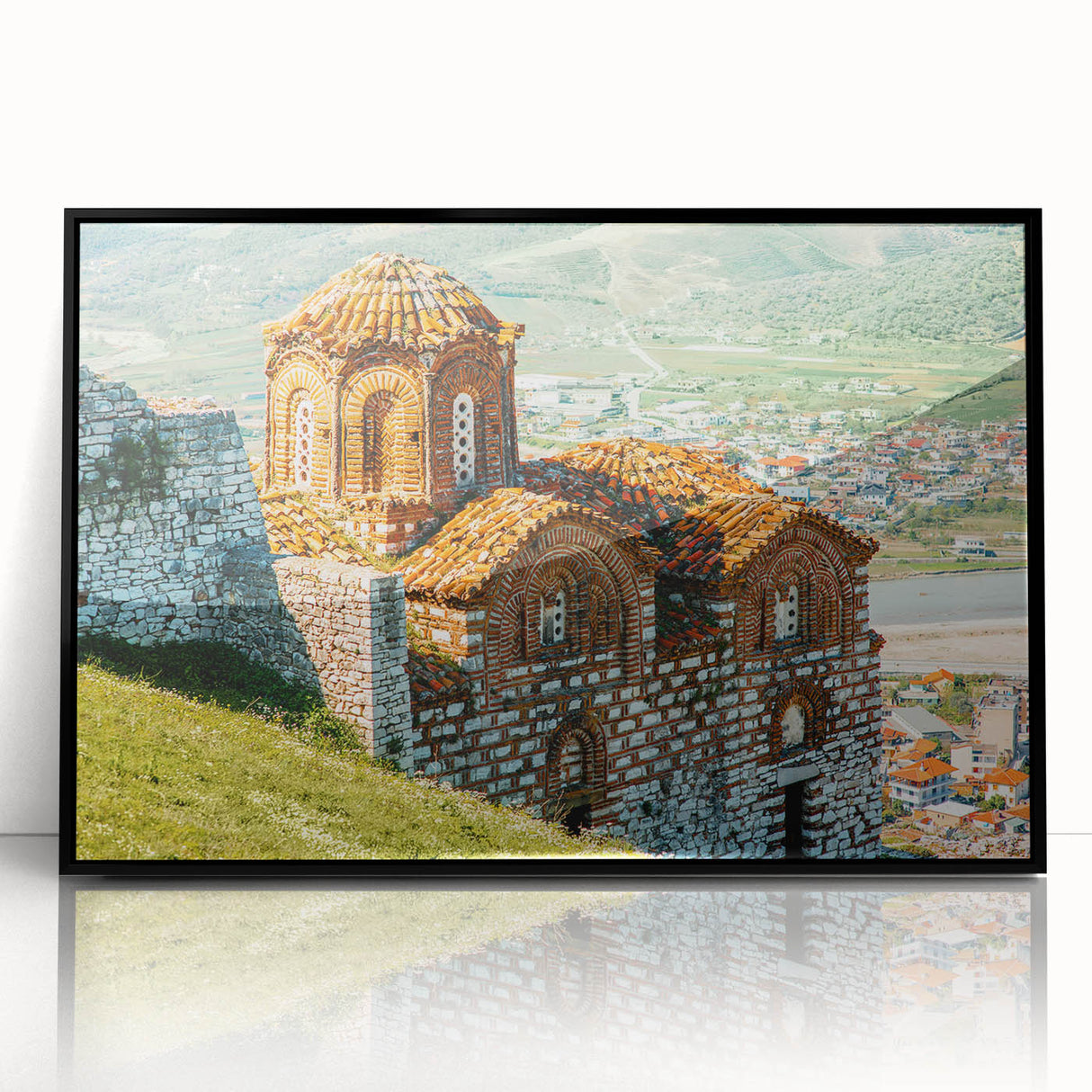 Large abstract wall art depicting a European Albanian scenery in muted earth tones on a black framed acrylic print.