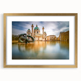 Abstract art print of a European scenery in muted gold and green tones on a framed canvas, suitable for dining room decor.