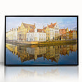Large abstract wall art depicting a European cityscape in muted gray and blue tones, framed in black acrylic.