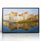 Large abstract wall art depicting a European cityscape in muted gray and blue tones, framed in black acrylic.