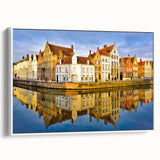Vintage poster art of a European Belgium scenery on a large framed canvas, featuring colorful art against a black background.