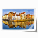 Rolled print of a Belgian landscape with vibrant green fields and a distant town, ideal for art wall dining room.