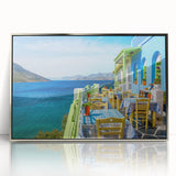 Large art print of a European Cyprus landscape in muted green and blue tones, framed in silver acrylic.