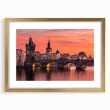 Abstract art print of Prague skyline in muted gold tones on a framed canvas, suitable for dining room decor.