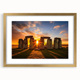 Abstract art print of Stonehenge in muted earth tones on a gold-framed mat, suitable for dining room decor.