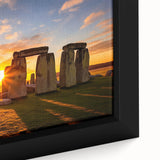 Close-up of a black framed canvas depicting Stonehenge in textured, colorful art.