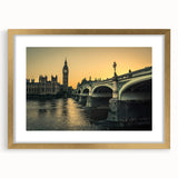 Abstract art print of the Thames River in muted blue and gray tones, framed in gold, suitable for dining room decor.
