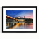 Extra large abstract art print of Lyon scenery in vibrant colors on textured canvas, framed in black.