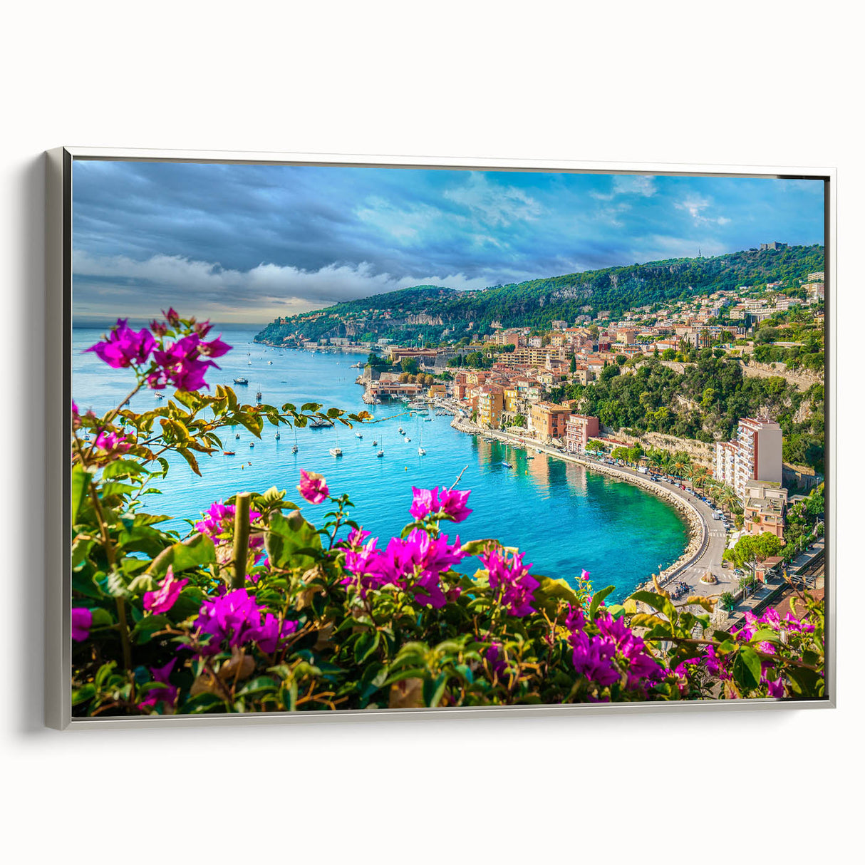 Framed canvas of a vintage-style landscape painting depicting the colorful coastline of Nice, France.