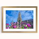 Abstract art print of Munich skyline in muted gold and blue tones, framed with a golden mat, suitable for dining room decor.