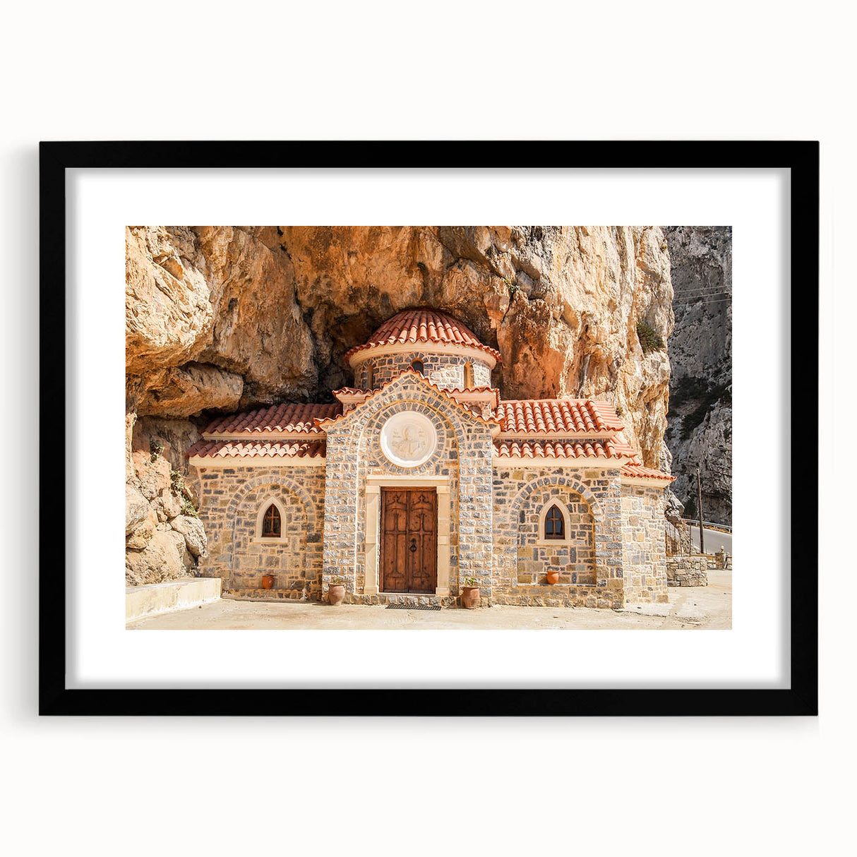 Abstract art print of a vibrant, colorful European scenery on a large textured canvas, framed in black.