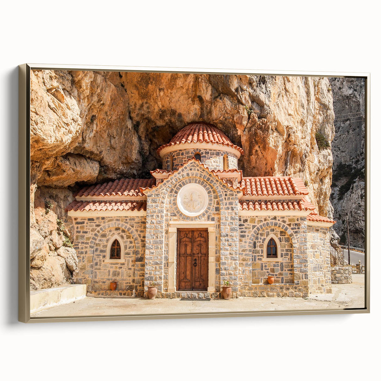 Framed canvas wall art of a vintage-style black and gold landscape painting of Crete, Greece, ideal for bedroom decor.