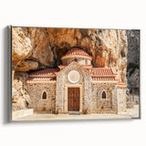 Framed canvas of a vintage-style landscape painting featuring the colorful Crete coastline against a black sky.