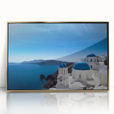 Art deco poster of Santorini landscape with white buildings and blue domes, framed in gold acrylic.