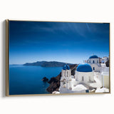 Framed canvas depicting a vintage-style Santorini landscape in black and gold, ideal for bedroom wall art.