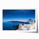 Rolled print of Santorini scenery with white buildings and blue domes, ideal for art wall dining room.