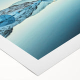 Art deco poster of Greenland scenery on rolled canvas, featuring muted green and blue tones.