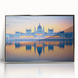 Large art print of a mid-century modernist European cityscape in muted earth tones on framed acrylic.