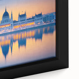 Extra large framed canvas featuring a textured depiction of a European scenery in black with colorful accents.
