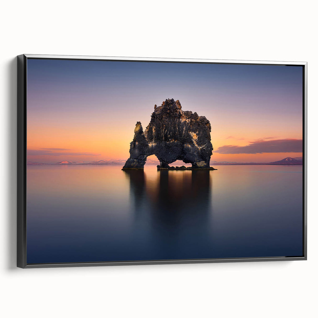 Black and white wall art featuring a vintage poster-style landscape of Iceland on a framed canvas, ideal for bedroom decor.