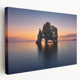Side view of a stretched canvas featuring a serene Iceland landscape in muted blue and green tones.