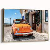 Framed canvas wall art featuring a vintage-style landscape painting of the Amalfi Coast in muted gold and black tones.