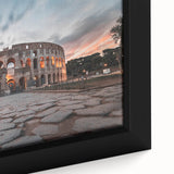 Black wall art featuring a textured, colorful depiction of the Colosseum in Rome on a framed canvas.