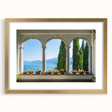 Abstract art print of Lake Como with muted blue and green tones on a framed canvas, ideal for dining room decor.
