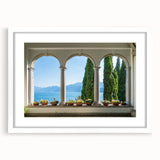 Textured art of Lake Como with abstract design in muted blues and greens, framed with a white mat.