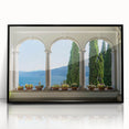 Large abstract wall art of Lake Como with muted blue and green tones, framed in black acrylic.