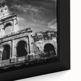 Close-up of black wall art featuring a textured, colorful depiction of Rome on a framed canvas.