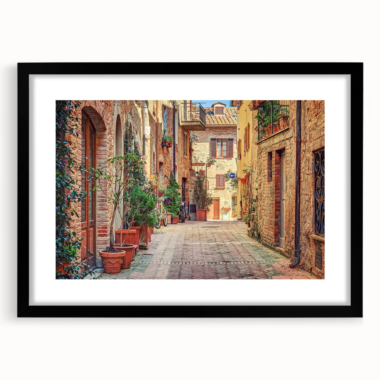 Extra large abstract art print of a vibrant Tuscan landscape on textured canvas, framed in black.