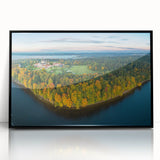 Large abstract wall art depicting a European Lithuanian landscape in muted earth tones, framed in black acrylic.