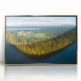 Art deco poster featuring a serene Lithuanian landscape in soft pastel tones, framed in gold acrylic.