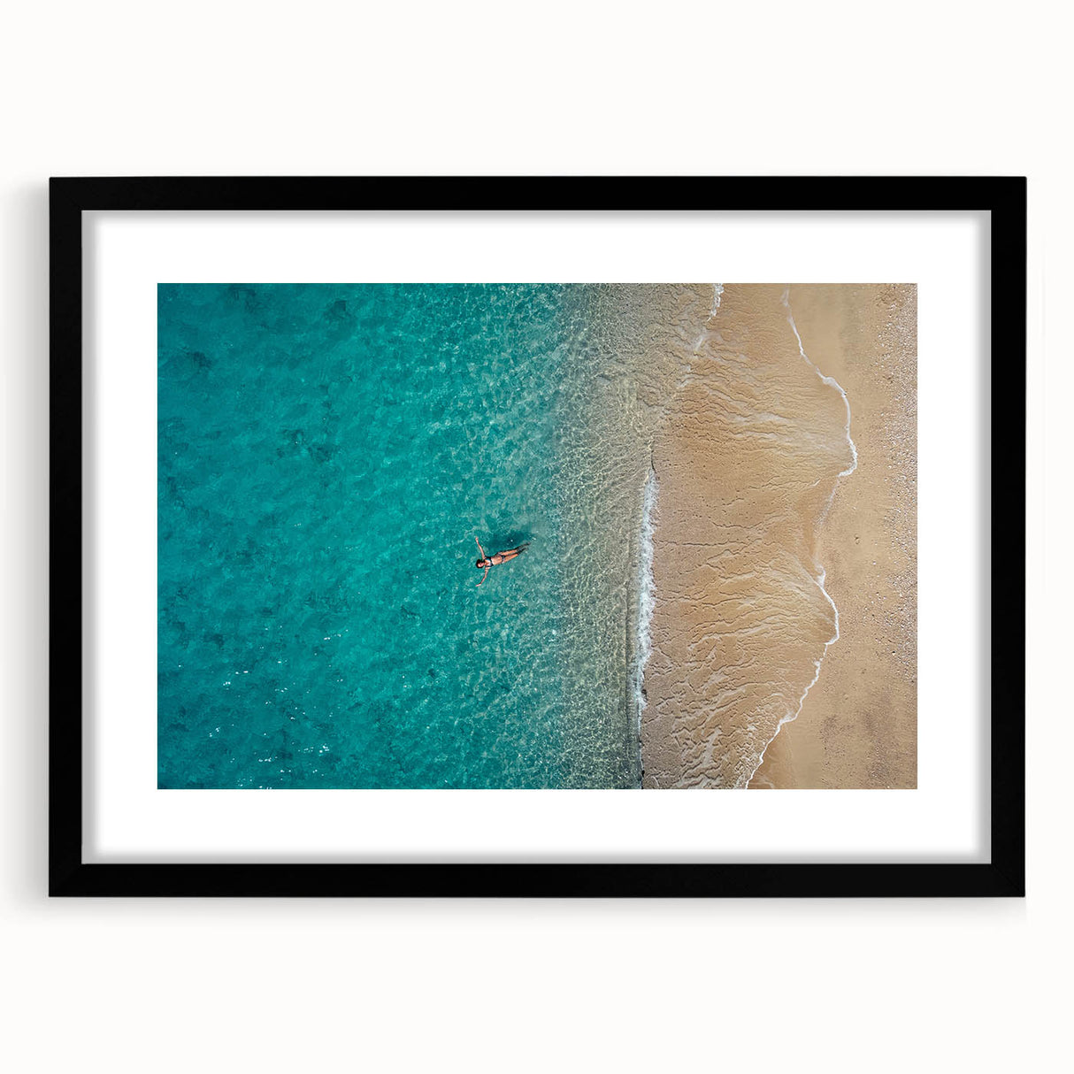 Abstract art print of the Mediterranean Sea with vibrant blue and white hues on a textured canvas, framed in black.