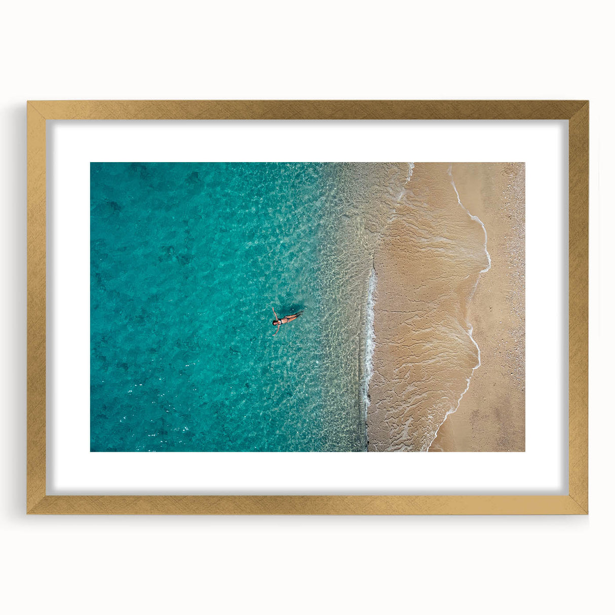 Abstract art print of the Mediterranean Sea in muted blue and teal, framed in gold.