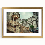 Abstract art print of Monaco scenery in muted gold and blue tones, framed with a gold mat, suitable for dining room decor.