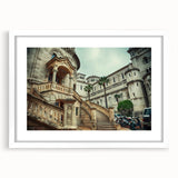 Textured abstract art print of Monaco scenery in muted blue and gray, framed with a white mat, suitable for bedroom decor.