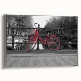 Framed canvas of Amsterdam landscape in vintage poster style, featuring colorful art on a black background.